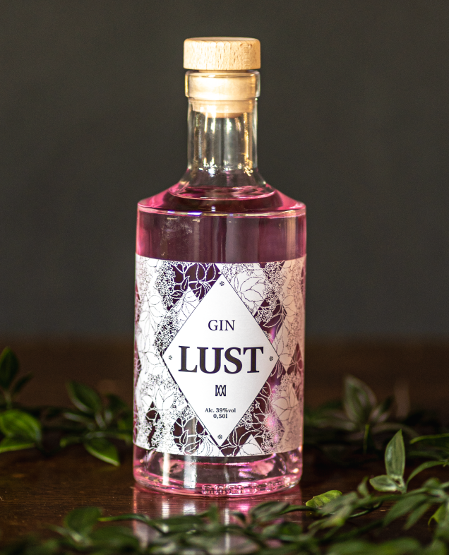 Clear bottle with pink spirit labeled 'Gin Lust.'