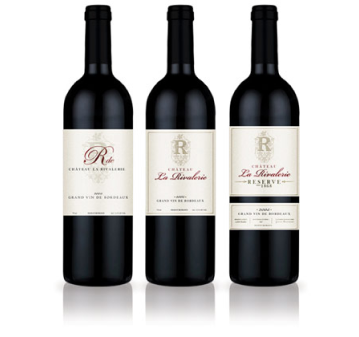 Three dark wine bottles with black caps and beige labels showing the same brand.